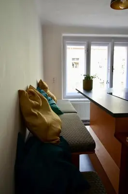 a group of pillows sitting on a bench in a room at Karlštejn 34 in Karlštejn