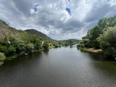 a view of a river from a bridge at Karlštejn 34 in Karlštejn