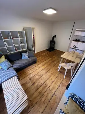 a living room with a couch and a table at Karlštejn 34 in Karlštejn