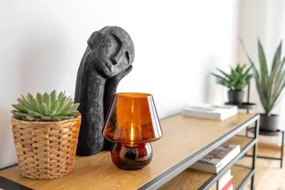 a black statue sitting on top of a table at Stylish Apartment - Free Parking, Cinema, by Gravity Prague in Prague