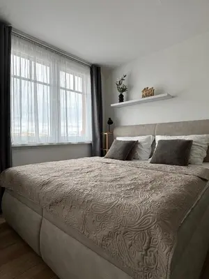 a living room with a couch and a coffee table at Smarty Choice Living with FREE PARKING - Vondroušova in Prague