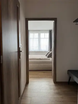 a living room with a couch and a table at Smarty Choice Living with FREE PARKING - Vondroušova in Prague