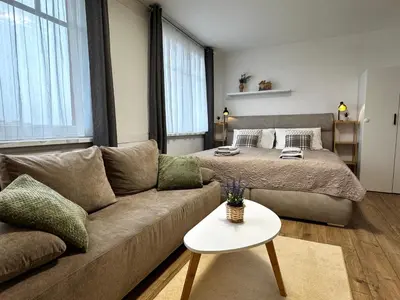 a bathroom with a white sink and a shower at Smarty Choice Living with FREE PARKING - Vondroušova in Prague