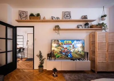 a living room with a video game on the tv at 2BR 1,5Bath Chic City Suite near Wenceslas Square in Prague