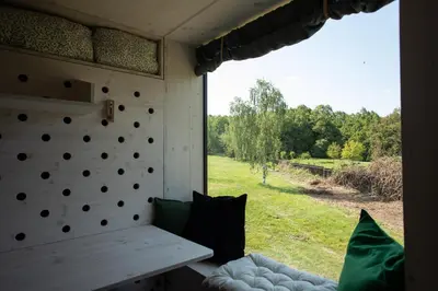 a room with a window with a view of a field at Prague Camping Dzban in Prague