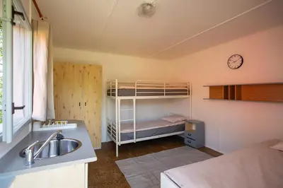 a bathroom with a sink and a bunk bed at Prague Camping Dzban in Prague