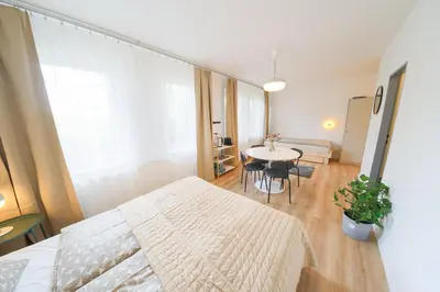 a bedroom with a bed and a table in a room at Prague Camping Dzban in Prague