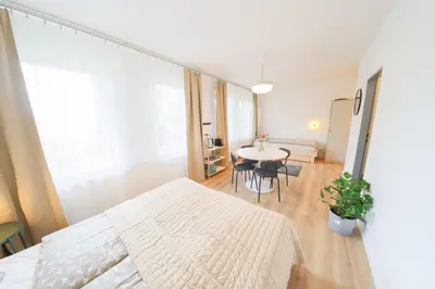 a small room with a bed and a table at Prague Camping Dzban in Prague