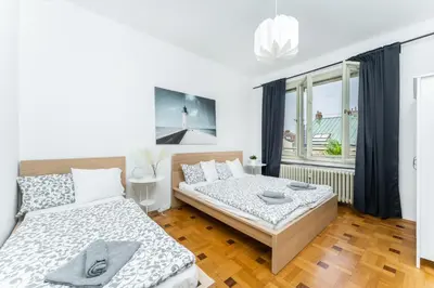 a bedroom with two beds and a window at La Terrasse Apartment Prague center in Prague