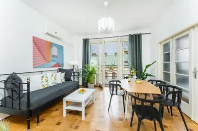 a living room with a bed and a table at La Terrasse Apartment Prague center in Prague
