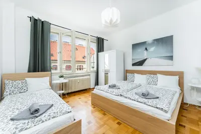 a bedroom with two beds and a window at La Terrasse Apartment Prague center in Prague