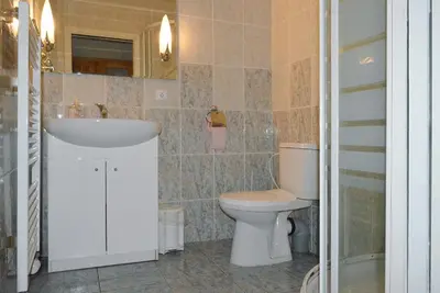 a bedroom with a bed and a desk and a chair at Šestajovický pivovar ubytování in Šestajovice