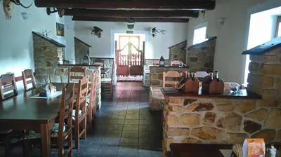 a living room with two chairs and a table at Šestajovický pivovar ubytování in Šestajovice