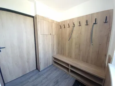 a room with wooden walls and a closet at Relax apartmán Pod Javorem in Kladno