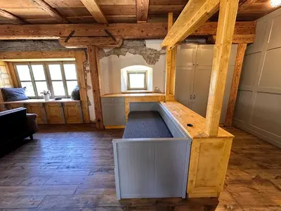 a large room with a tub in the middle of a room at Farma Bláto - Apartmány Sýpka a glamping in Uhlířské Janovice