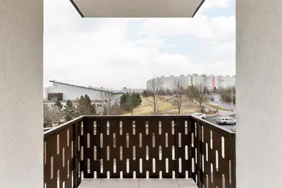 a balcony with a view of a city at Stay2gether Japandi Homestay for 4 - Metro B Luka in Prague