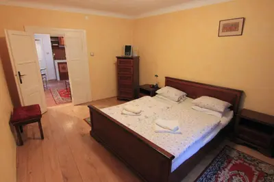 a bedroom with a bed with two towels on it at Prokopska in the heart of Mala Strana in Prague