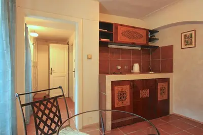 a kitchen with a staircase leading into a room at Prokopska in the heart of Mala Strana in Prague