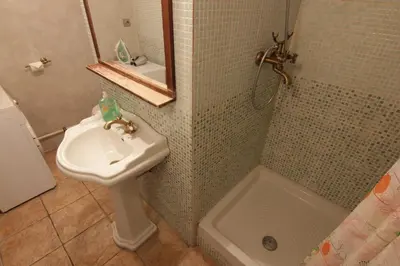 a bathroom with a sink and a toilet and a shower at Prokopska in the heart of Mala Strana in Prague
