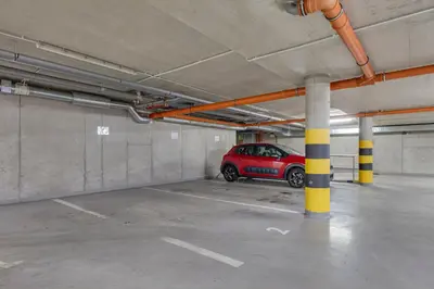 a parking garage with a car parked in it at Centrum Royal Studio in Prague