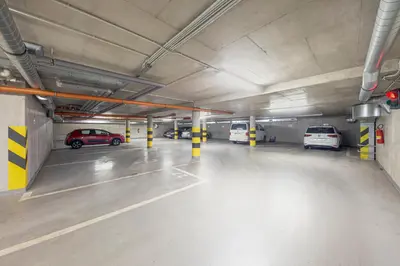 an empty parking garage with cars parked in it at Centrum Royal Studio in Prague