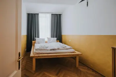 a bed in a room with a window at Bohemian Experience in Prague
