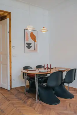 a dining room with a table and chairs at Bohemian Experience in Prague