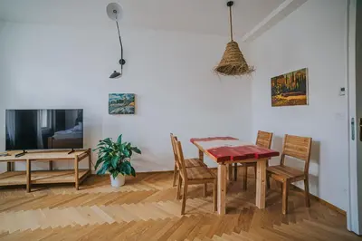 a dining room with a table and chairs at Bohemian Experience in Prague