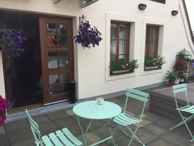 a patio with a table and chairs and a door at Old Town Boutique Apartments in Prague