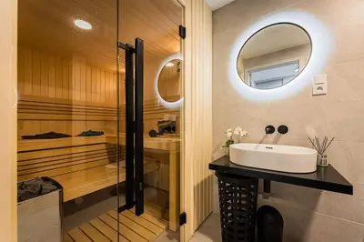 a bathroom with a sink and a mirror at Romantic wellness apartment in Prague