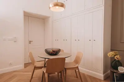 a dining room with a table and chairs at Stylish new apartment in Prague with A/C in Prague