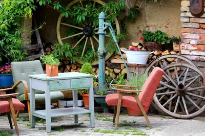 a group of chairs and a table and a wheel at Penzion U Lasíků in Únětice