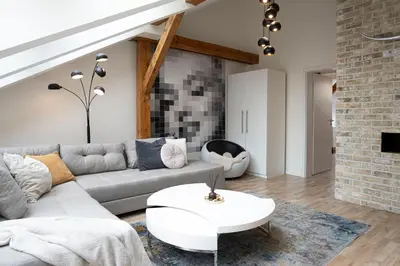 a living room with a couch and a table at Rentero Marilyn Monroe Apartment with AC in Prague center in Prague