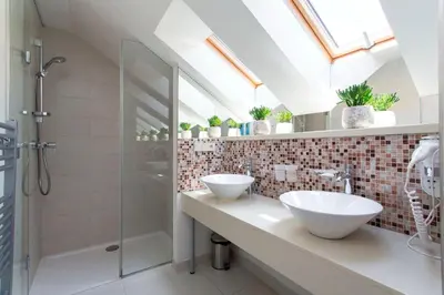 a bathroom with two sinks and a shower at Rentero Marilyn Monroe Apartment with AC in Prague center in Prague