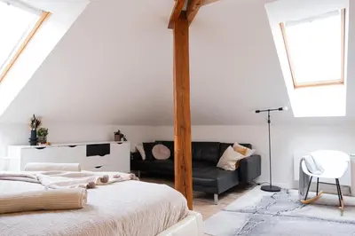 a bedroom with a bed and a couch at Rentero Marilyn Monroe Apartment with AC in Prague center in Prague