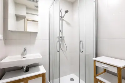 a bathroom with a shower and a sink at Apartment near the subway with a terrace in Prague