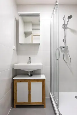 a bathroom with a sink and a shower at Apartment near the subway with a terrace in Prague