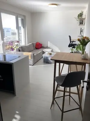a living room with a table and a couch at Apartment Little Hill in Prague