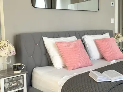 a bedroom with a bed and a tv on the wall at Praha 1 Florenc Hlavní mesto Romantic Apartments in Prague