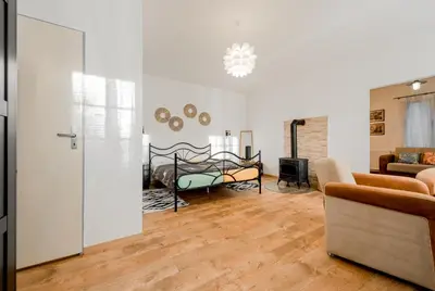 a living room with a bed and a couch at Apartman Lucie in Liběchov