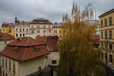 a view of the roofs of buildings in a city at Liliova Apartments in Prague