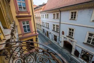 a view of an alley from a balcony of a building at Liliova Apartments in Prague