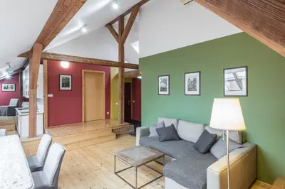 a living room with a couch and a table at Liliova Apartments in Prague