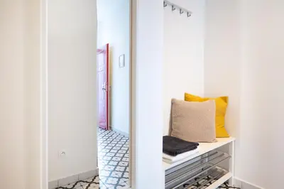 a hallway with a mirror and a dresser at Negrelli Residence - main BUS station in Prague