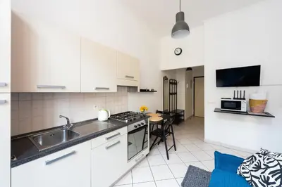 a kitchen with a sink and a stove top oven at Tyrsova Apartment in Prague