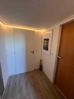 an empty room with a hallway with a door at Studio Prosecká vyhlídka in Prague