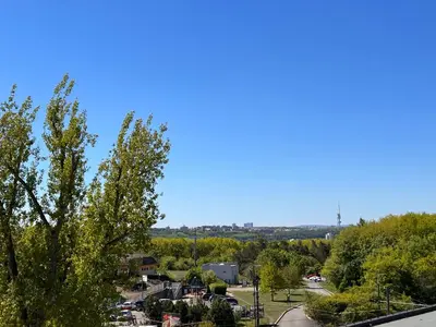 a view of a city with trees and a street at Studio Prosecká vyhlídka in Prague