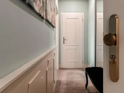 a hallway with a door leading to a room at ELSO Muzeum apartments in Prague