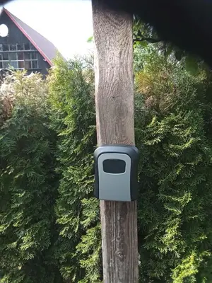 a tv on the side of a tree at Mobilní dům Venda in Hradištko