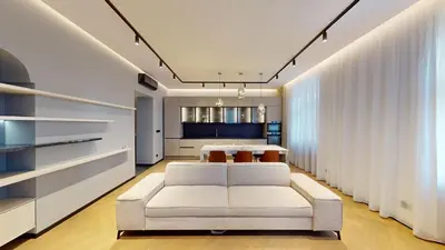 a living room with a white couch and a table at Naprstek Castle View Residence in Prague